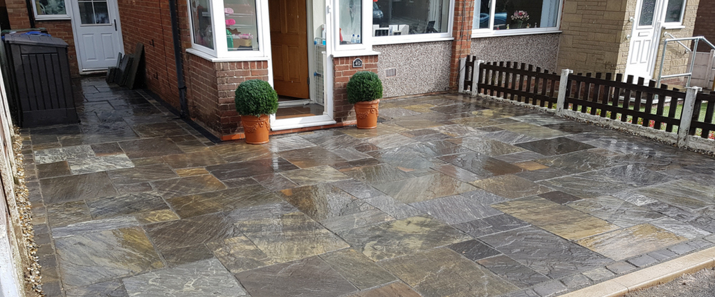 Farmhouse Premium Indian Sandstone driveway, featuring deep charcoal tones and a reclaimed-style, pebble-worn finish for a heritage-inspired look