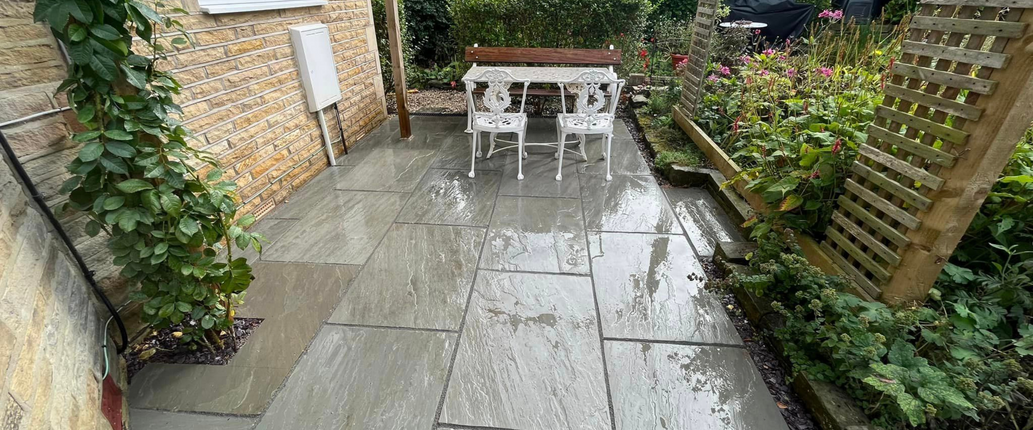 Kandla Grey Indian Sandstone paving slabs with a natural riven surface and hand-cut edges, ideal for patios, paths, and outdoor spaces