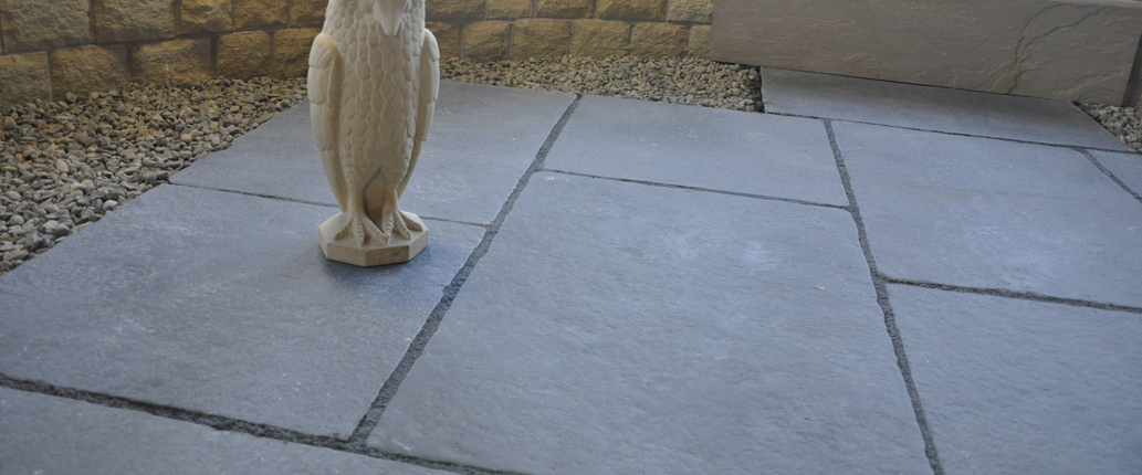 Regency Period Grey Limestone patio with a soft aged grey finish, laid in a mixed-size pattern to complement traditional and heritage outdoor spaces.